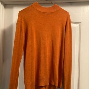 Bright orange turtle neck